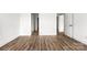 Hallway showcasing hardwood flooring and white trim at 244 Little Wilkesboro Rd, Harmony, NC 28634