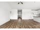 Open-concept living space with wood-look floors connecting the living room, kitchen, and entryway for easy flow and entertaining at 244 Little Wilkesboro Rd, Harmony, NC 28634