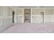 Spacious living room featuring bare drywall ready for customization and ample natural light at 244 Little Wilkesboro Rd, Harmony, NC 28634