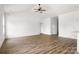 Open-concept living room featuring hardwood floors, white walls, and recessed lighting at 244 Little Wilkesboro Rd, Harmony, NC 28634