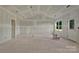 Bright living room boasting bare drywall, large windows, and an open layout perfect for customization at 244 Little Wilkesboro Rd, Harmony, NC 28634