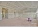 Spacious living room featuring bare drywall ready for customization and high vaulted ceilings at 244 Little Wilkesboro Rd, Harmony, NC 28634