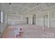 Bright living room featuring bare drywall, high vaulted ceilings, and an open layout at 244 Little Wilkesboro Rd, Harmony, NC 28634