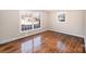 Hardwood floor bedroom with large window and closet at 2617 Fairgreen Dr, Gastonia, NC 28056