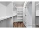 Spacious walk-in closet with ample shelving and hanging space at 4006 Avalon Ave, Charlotte, NC 28208