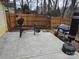 Large concrete patio with weight bench, grill, and punching bag at 4020 Brandie Glen Rd, Charlotte, NC 28269