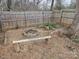 Backyard with firepit, wooden bench, and string lights at 4020 Brandie Glen Rd, Charlotte, NC 28269