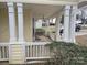 Inviting front porch with white columns and railings at 4020 Brandie Glen Rd, Charlotte, NC 28269