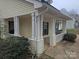 Home's front porch with white columns and railing at 4020 Brandie Glen Rd, Charlotte, NC 28269