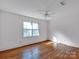 Bedroom with hardwood floors and large window at 410 Lakenheath Ln, Matthews, NC 28105