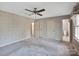 Spacious bedroom with ceiling fan and carpet flooring at 410 Lakenheath Ln, Matthews, NC 28105