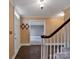 Bright entryway with slate floor, coat rack, and view to living room at 410 Lakenheath Ln, Matthews, NC 28105