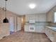 Bright kitchen with white cabinets and tile floor at 410 Lakenheath Ln, Matthews, NC 28105