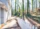 White picket fence along a side yard path at 410 Lakenheath Ln, Matthews, NC 28105