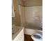 Bathroom with a shower/tub combo and white vanity at 410 W Davidson Ave, Gastonia, NC 28052