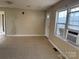 Simple living room with vinyl flooring and window at 410 W Davidson Ave, Gastonia, NC 28052