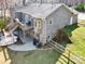 The rear exterior features a spacious deck, a fenced yard, and lush greenery at 412 Wildlife Rd, Troutman, NC 28166