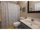 Clean bathroom with shower and floral patterned curtain at 412 Wildlife Rd, Troutman, NC 28166