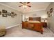 Bright bedroom featuring a wooden bed frame and ample natural light at 412 Wildlife Rd, Troutman, NC 28166