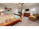 Spacious bedroom with a comfortable sitting area and large windows at 412 Wildlife Rd, Troutman, NC 28166