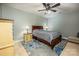 Bright bedroom featuring a double bed, ceiling fan, and ample floor space at 412 Wildlife Rd, Troutman, NC 28166