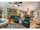 Open living area with stone fireplace, and access to the kitchen at 412 Wildlife Rd, Troutman, NC 28166