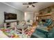 Spacious living room with stone fireplace, comfy seating, and large TV at 412 Wildlife Rd, Troutman, NC 28166