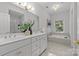 Elegant bathroom with double vanity and soaking tub at 5204 Sardis Rd, Charlotte, NC 28270