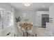 Bright dining area with a round table and four chairs, near kitchen at 5204 Sardis Rd, Charlotte, NC 28270