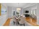 Elegant dining room with a wooden table, neutral decor, and an open feel at 5204 Sardis Rd, Charlotte, NC 28270