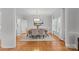 Bright dining room with hardwood floors, a wood table, and six chairs at 5204 Sardis Rd, Charlotte, NC 28270