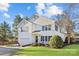 Two-story house with white siding, a large garage, and a well-maintained lawn at 5204 Sardis Rd, Charlotte, NC 28270
