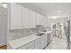 Clean kitchen featuring white shaker cabinets, quartz countertops, and a breakfast nook at 5204 Sardis Rd, Charlotte, NC 28270