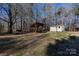 Large backyard with storage shed and covered structure at 5411 Mcwhorter Rd, Waxhaw, NC 28173