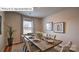 Bright dining room featuring a wood table and neutral decor at 564 Zermatt Ct, Monroe, NC 28112