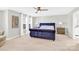 Spacious bedroom with plush velvet headboard and plenty of natural light at 5715 Hammermill Dr, Harrisburg, NC 28075