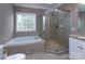 Bathroom with soaking tub and glass shower enclosure at 617 Crosswater Ln # B, Fort Mill, SC 29708