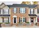 Brick front of townhouses with white picket fence at 634 Atherton Way, Rock Hill, SC 29730