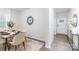 Dining room flows into the entry featuring a wood-look floor and stylish decor at 8024 Kennesaw Dr, Gastonia, NC 28056