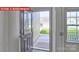 Front entry with glass-paned door and view of the front yard at 8024 Kennesaw Dr, Gastonia, NC 28056