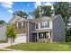 Charming two-story home with a brick and siding facade, well-maintained lawn and a two car garage at 8024 Kennesaw Dr, Gastonia, NC 28056