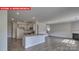Open concept kitchen and Gathering room with island and fireplace at 8024 Kennesaw Dr, Gastonia, NC 28056