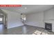 Open living room with hardwood floors and a view of the staircase at 8024 Kennesaw Dr, Gastonia, NC 28056