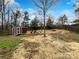 Backyard with shed and partially fenced in at 8331 Burgundy Ridge Dr, Harrisburg, NC 28075