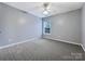 Well-lit bedroom with ceiling fan and window at 8331 Burgundy Ridge Dr, Harrisburg, NC 28075