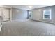 Bright bedroom with two windows and carpeted floor at 8331 Burgundy Ridge Dr, Harrisburg, NC 28075