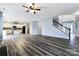 Open kitchen with island and stainless steel appliances at 8331 Burgundy Ridge Dr, Harrisburg, NC 28075