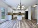 Modern kitchen with white cabinets and granite countertops at 8331 Burgundy Ridge Dr, Harrisburg, NC 28075