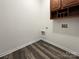 Convenient laundry room with built-in cabinets at 8331 Burgundy Ridge Dr, Harrisburg, NC 28075