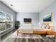 Virtually staged main bedroom with wood bed frame and large window at 8331 Burgundy Ridge Dr, Harrisburg, NC 28075